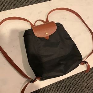 Longchamp black backpack purse.